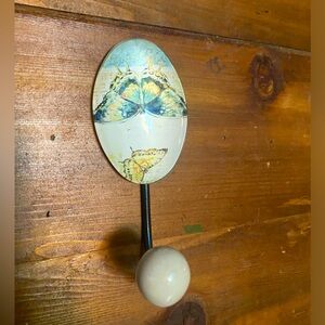 Decorative butterfly hook would be gray for dish towel or hand towel